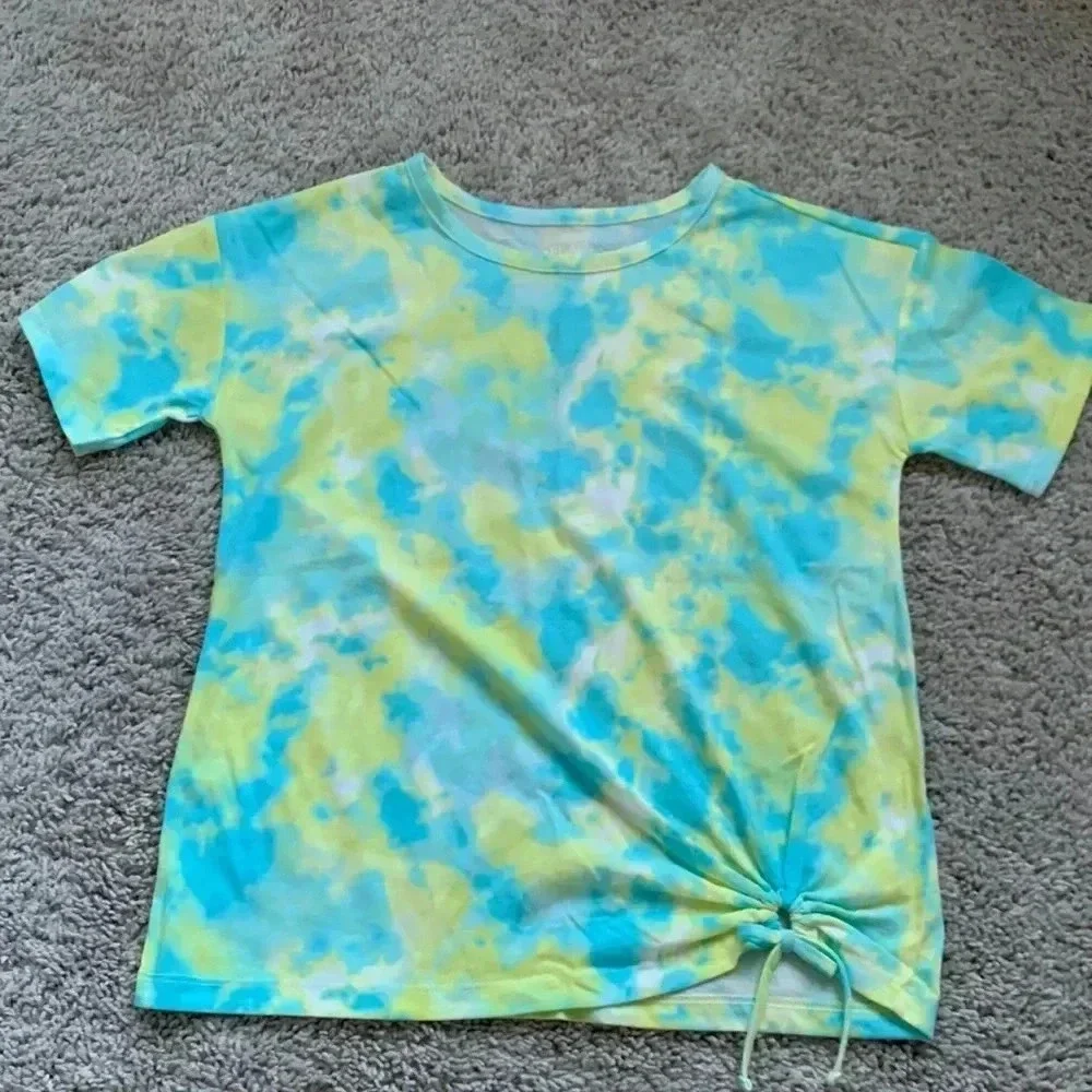 Girls tie dye shirt with cute detail on the bottom right part of the shirt